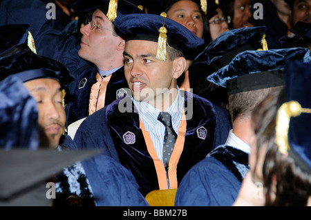Graduation ceremony portrait of a graduate wearing cap and gown Stock Photo
