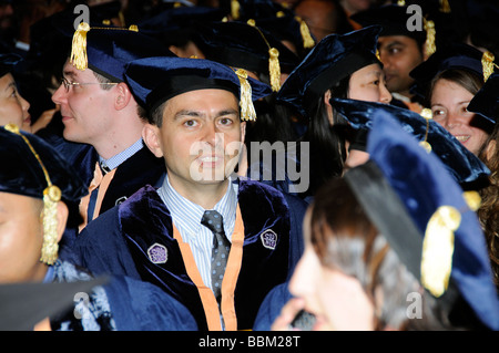 Graduation ceremony portrait of a graduate wearing cap and gown Stock Photo