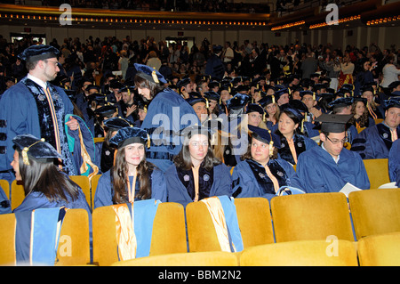 Graduation ceremony doctoral graduates wearing caps and gowns during the presentations at Lincoln Center new York USA Stock Photo