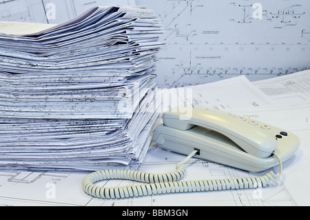 Telephones and project drawings Stock Photo