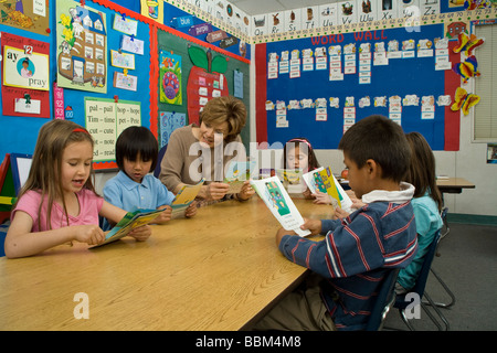 Elementary kids reading interracial multi ethnic racial diversity racially diverse multicultural multi cultural  class learning read MR  © Myrleen Pe Stock Photo