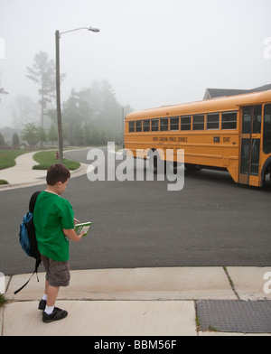 Waiting at the school bus stop -1 Stock Photo