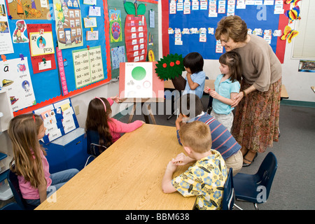 Teacher multi racial diversity racially diverse multicultural cultural  mixed racially mix kindergarten interracial inter racial POV United States Stock Photo
