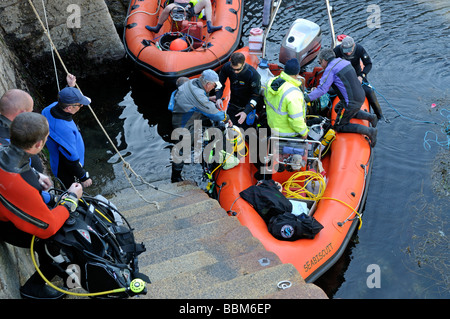 Scuba divers loading RIB dive boat Fort Bovisand harbour Plymouth Devon England Stock Photo