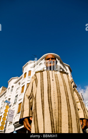 A Moroccan man dressed in his traditional Jalaba Stock Photo