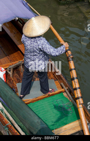 Top shot oarswoman in the ancient water town of Zhouzhuang Jiangsu China Stock Photo