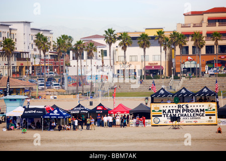 Surfers competing in the Katin Pro Am surf competition at Huntington Beach Pier Orange County California Stock Photo