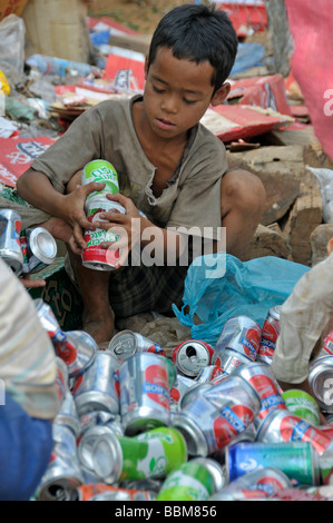Homeless child collecting cans, Poipet, Cambodia, Asia Stock Photo