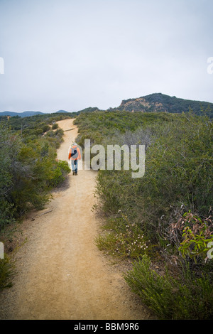 Hiker on the Backbone Trail in the Santa Monica Mountains Stock Photo
