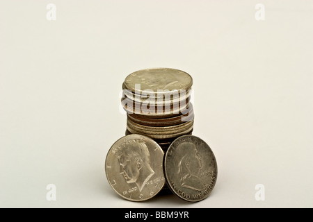 One stack of American half-dollar coins with the portraits of John F Kennedy and Benjamin Franklin. Stock Photo