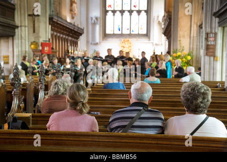 Church congregation listening to the choir singing, Great St Marys ...