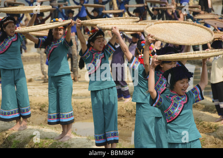 Hani Akha women and their rice sifting baskets at a festival in Yuanyang China Stock Photo