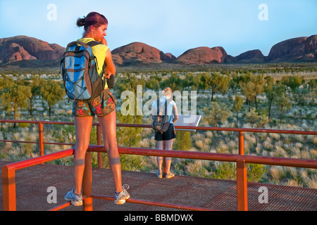 Austrailia, Northern Territory. Tourists watch sunrise over The Olgas, otherwise known as Kata Tjuta (meaning 'many heads' ) Stock Photo