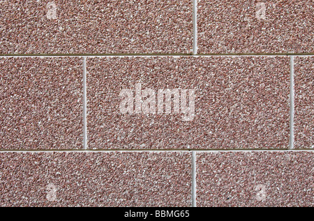 Abstract brown wall texture made of many small stones. marble granite gravel stone wall texture textured Stock Photo