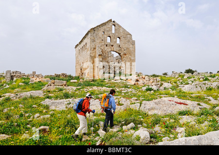 Hikers in front of ruins from the Byzantine era, Dead Cities near Aleppo, Syria, Middle East, Asia Stock Photo