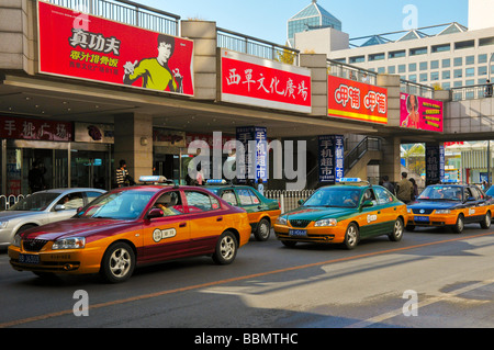Taxis in downtown Beijing next to Xidan shopping center Stock Photo