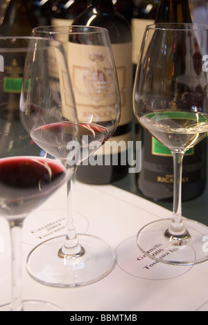 Bottles and glasses take their place on a specially marked place mat at a wine tasting at Castello Brolio in Chianti Stock Photo