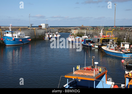 Boats in harbour, Seahouses, Northumberland, UK Stock Photo