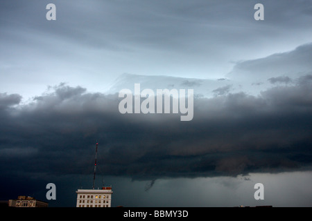 Roll cloud above a building. Stock Photo