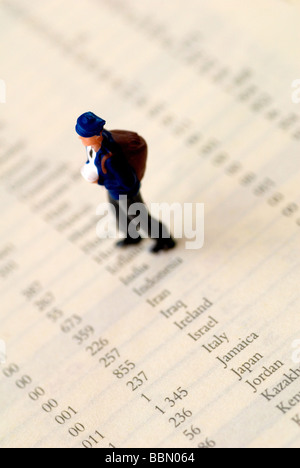 A conceptual using a figurine to portray a student travelling on a gap year Stock Photo