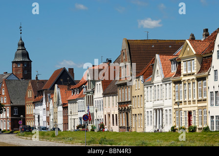 Glueckstadt, historic row of houses at the inland port with Wiebke Kruse-tower in the back, district Steinburg, Schleswig-Holst Stock Photo