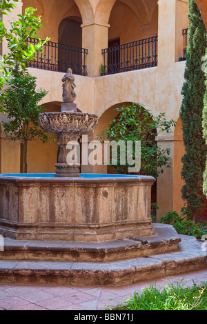 A courtyard and water fountain in the templo and exconvento de la Santa Cruz, built in the 17th century in Queretaro, Mexico Stock Photo