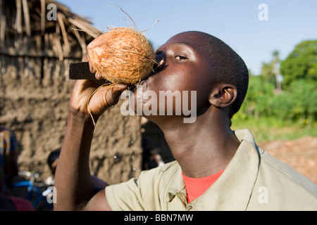 A man drinks fresh coconut milk Quelimane Mozambique Stock Photo