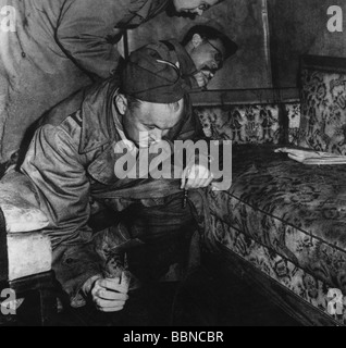 Adolf Hitler (1889-1945) looking out of the bars on the window to his ...