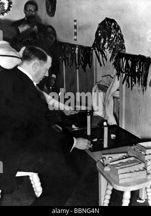 Hitler, Adolf, 20.4.1889 - 30.4.1945, German politician (NSDAP), Fuehrer and Reich Chancellor since 1933, half length, New Year`s Eve celebration, casting lead, photo by Eva Braun, Stock Photo