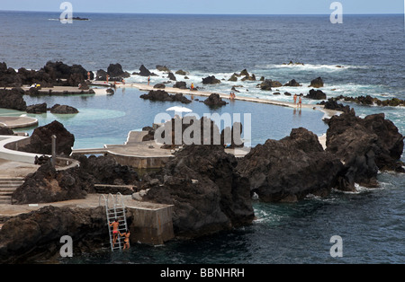 Natural ocean side volcanic swimming pool Porto Moniz Madeira Stock Photo