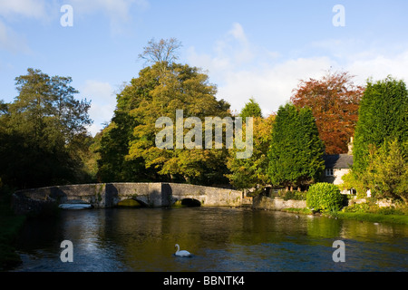 View of the River Wye and Sheepwash Bridge in the Autumn at Ashford in the Water near Bakewell in the Peak District Derbyshire Stock Photo