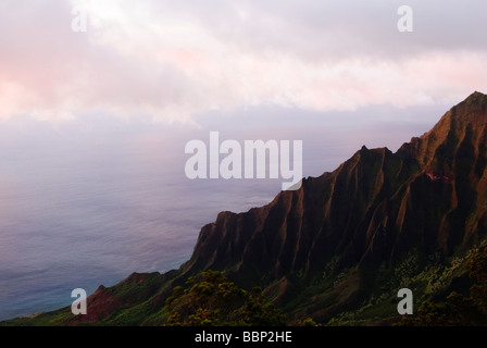 Alealau mountain towers over the Kalalau Valley at sunset on the on Na Pali coast of Kauai Hawaii USA Stock Photo