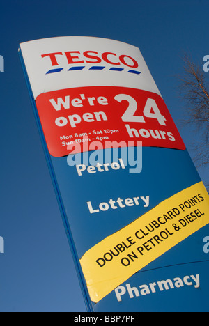 Sign outside a 24 hour Tesco supermarket in England. Stock Photo