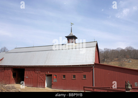 old barn on Muscoot Farm with weathervane mounted on roof Stock Photo