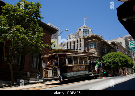 Cable car climbs slowly up Powell Street in San Francisco, California. Stock Photo