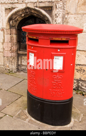 A red postbox in York in northern England. The ER symbol shows that it was cast in the reign of Queen Elizabeth. Stock Photo