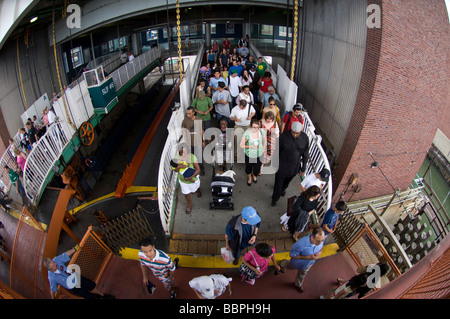 Passengers board the Staten Island Ferry on Staten Island to go to Manhattan Stock Photo