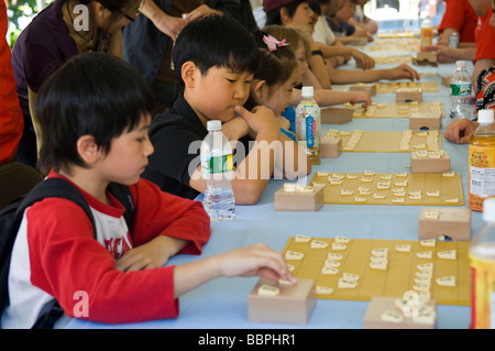 Children play the Japanese game of chess called Shogi Stock Photo