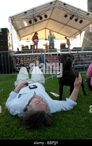 Man with his dog at Roc y Castell Castle Rock free music festival Aberystwyth Wales UK 30 May 2009 Stock Photo