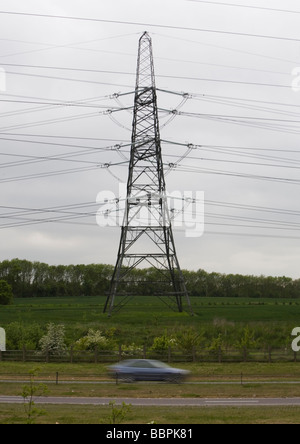 Electricity Pylons part of the National Grid stretch out across Essex U K Stock Photo
