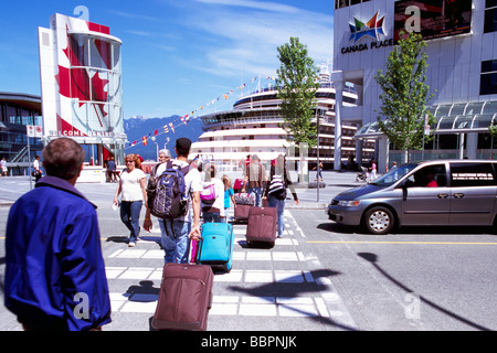 Tourists arriving at 'Canada Place' Trade and Convention Centre and Cruise Ship Terminal Vancouver British Columbia Canada Stock Photo