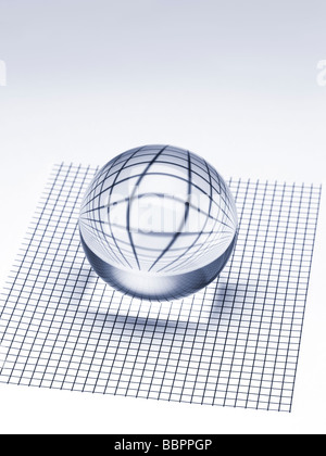 Abstract crystal ball on checked surface Stock Photo