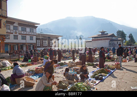 Market traders and customers at Paro vegetables and fruit market, Bhutan, Asia Stock Photo