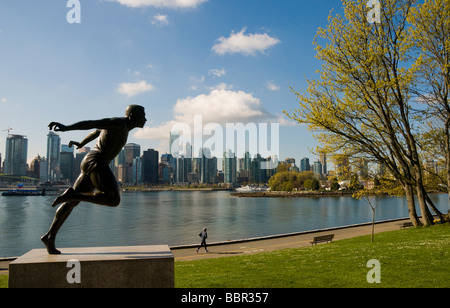 Stanley park Vancouver , the Harry Winston Jerome statue and the Vancouver skyline Stock Photo