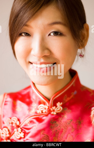 Young Chinese Woman in Silk Cheongsam