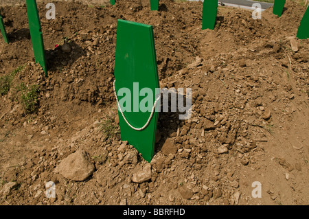 Fresh graveyard for Bosnian Muslims killed during Bosnian War in the village of Bratunac in Republika Srpska an entity of Bosnia and Herzegovina Stock Photo