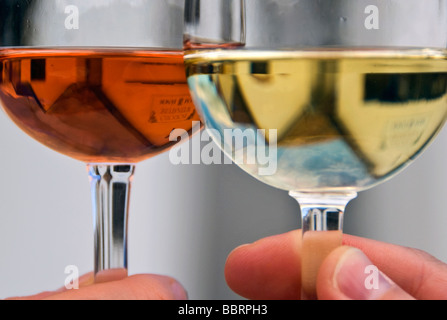 Close-up Of Hands Toasting Wine Glass Stock Photo