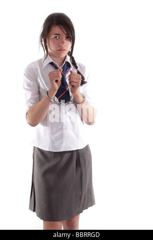Mixed race schoolgirl in handcuffs Stock Photo