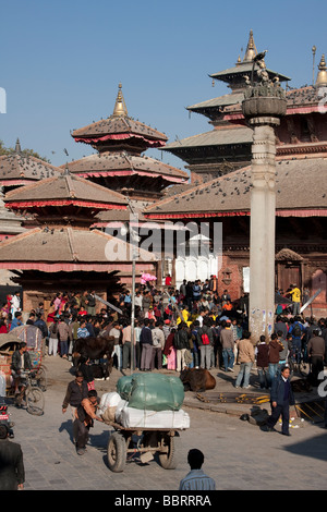 Kathmandu, Nepal. Durbar Square Crowd listening to a speaker under King Pratap Malla's Column on right, Jagannath Temple behind. Stock Photo