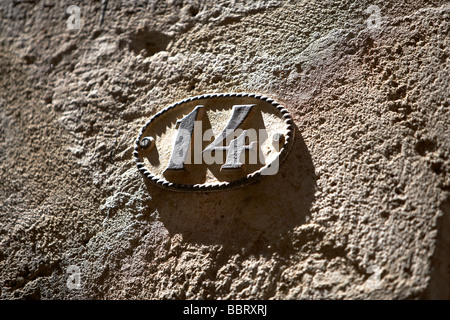 HOUSE NUMBER 14 CAST IRON Stock Photo